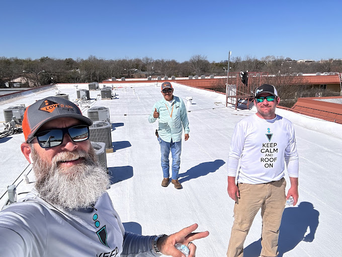 Crew walking a white commercial flat roof